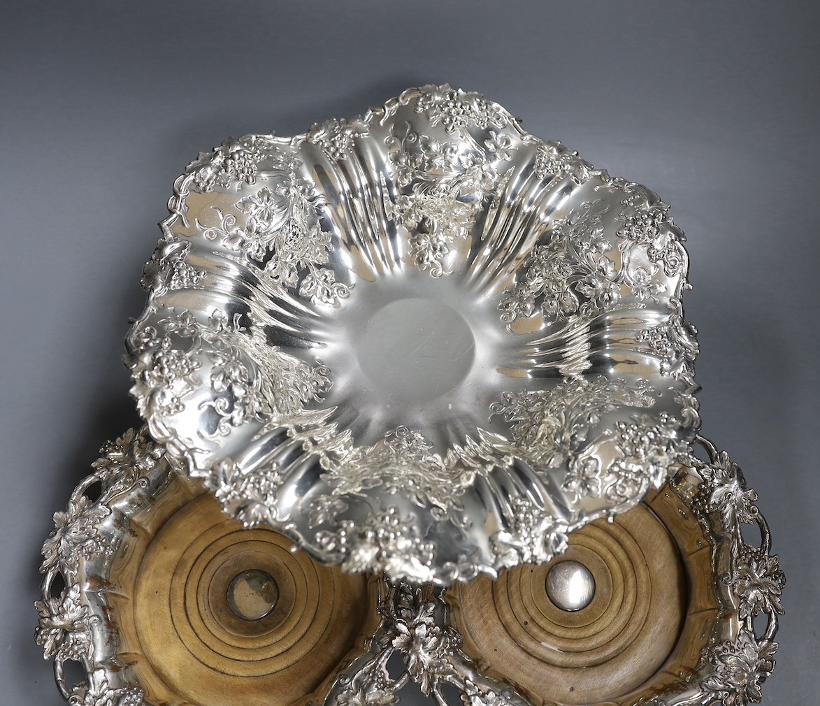 A pair of Victorian Sheffield plate wine coasters and plated comport, 13 cms high.